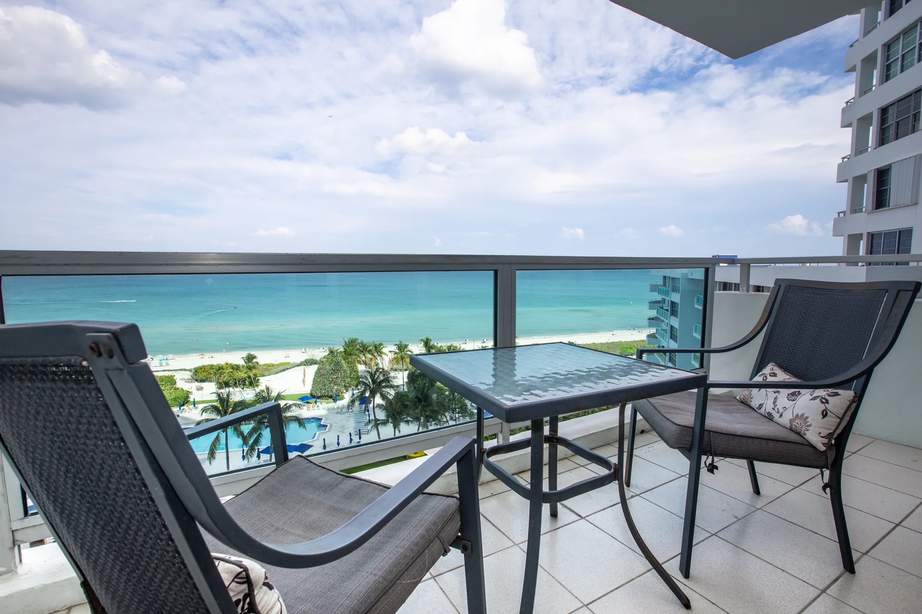 Table and chairs on an ocean-view balcony